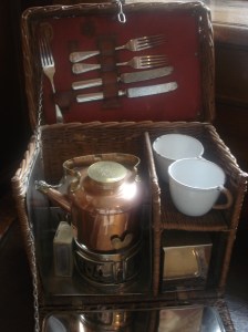 Picnic basket with small kettle. My Mum told me that her uncle had one that was a bit like this (but not as posh) and the kettle was powered by meths. 